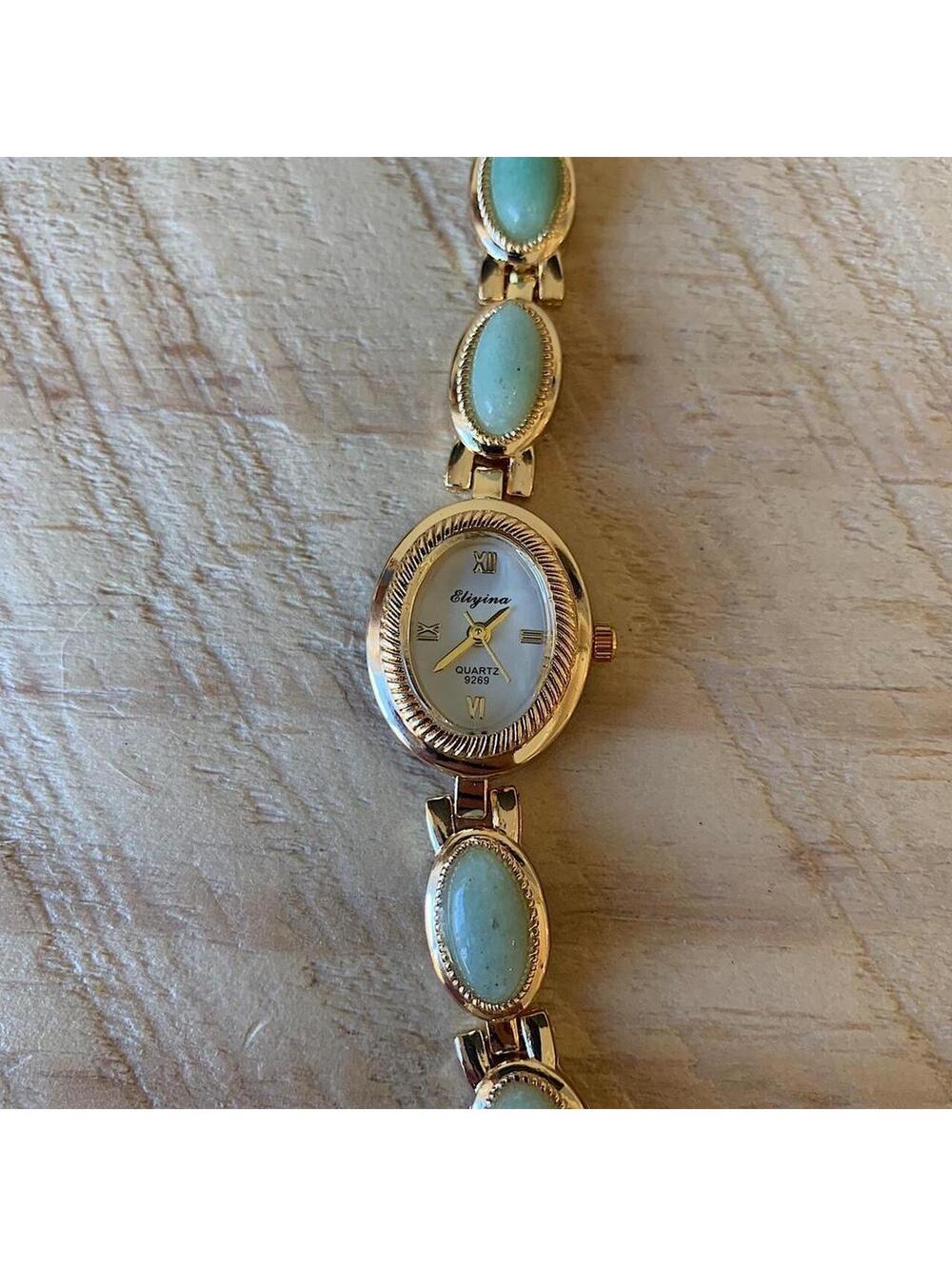 Dainty Gold watch with light blue jade stone opal accents. Item works tell time - Picture 4 of 8